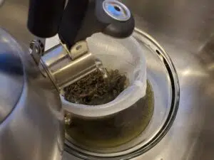 Flush cannabis trim with boiling water